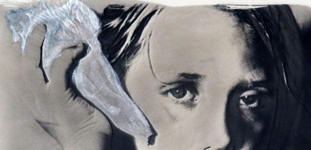 Detail of She Listens showing the watercolor painted sea shell and the child's intent eyes.