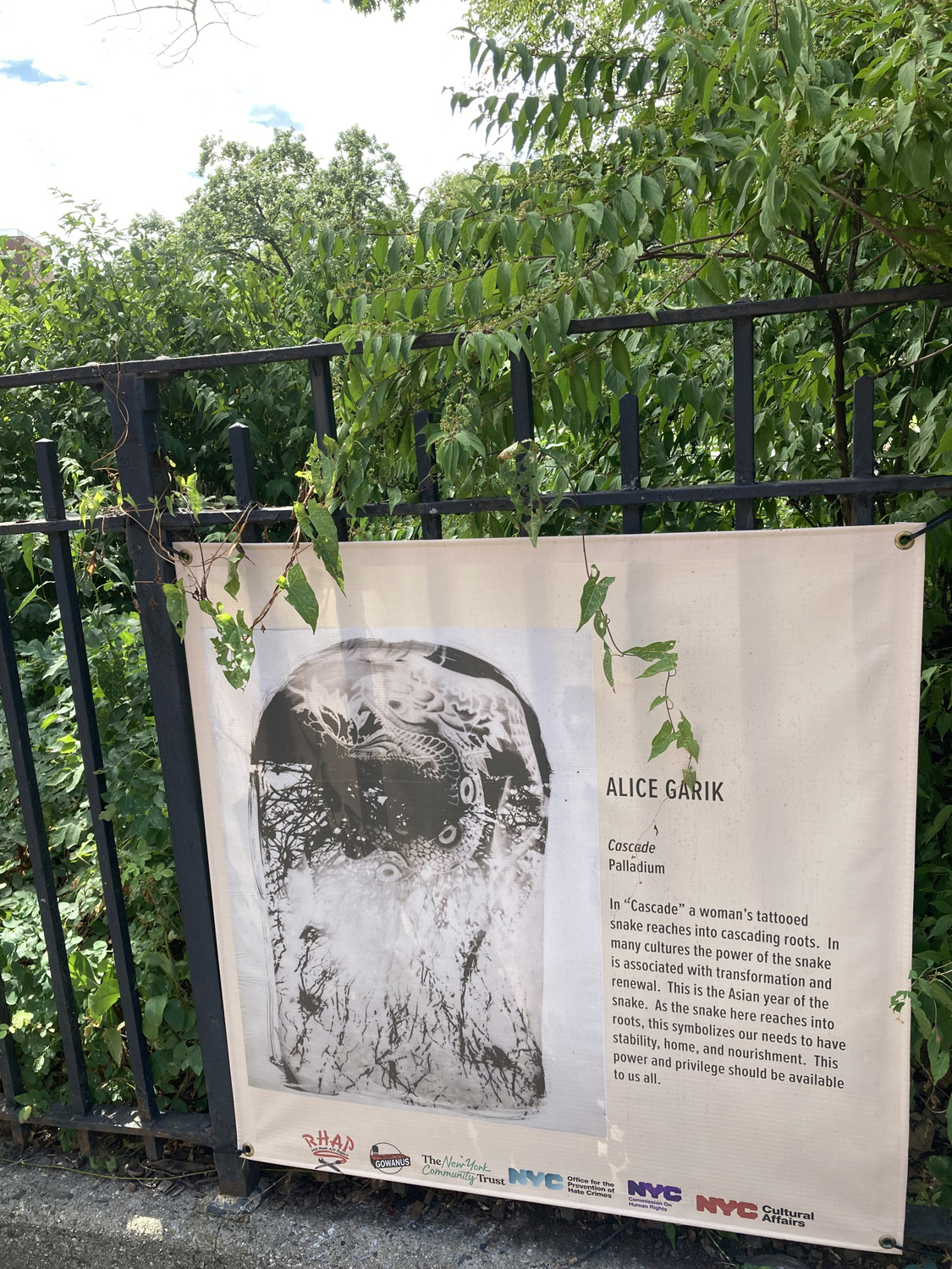 "Cascade" is an artwork displayed at Coffey Park in Red Hook, Brooklyn in the summer of 2025 as part of an exhibit titled Power, Privilege and Identity.