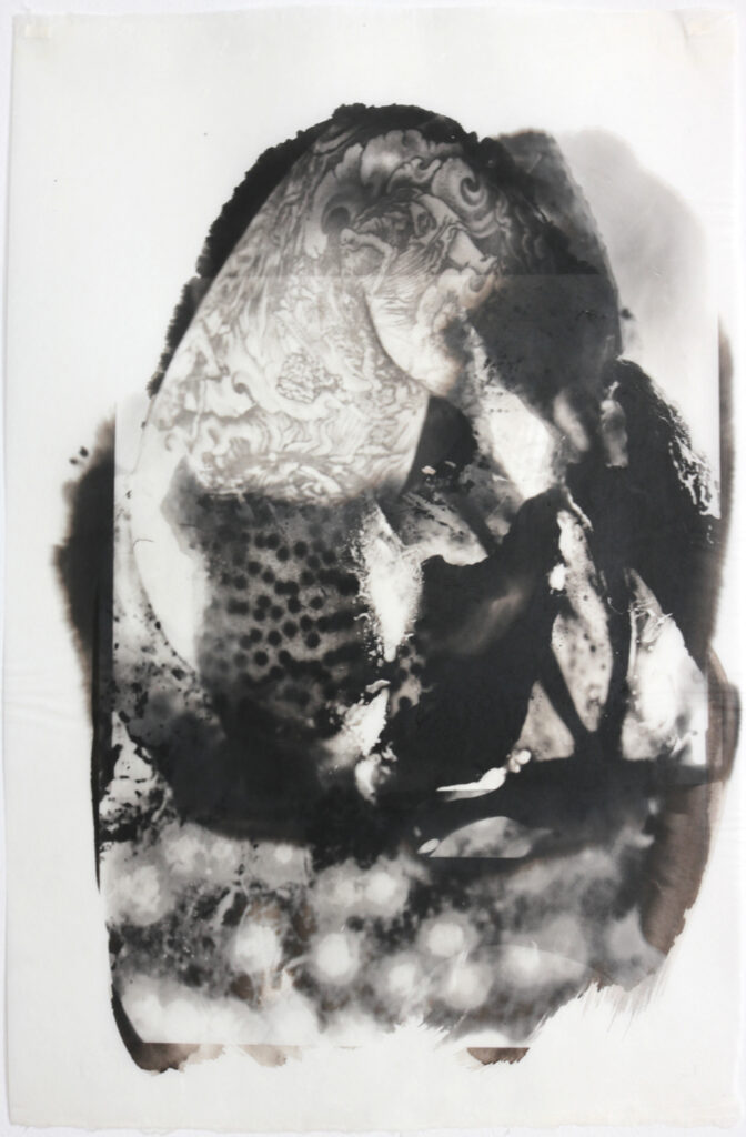 Referencing the occult tradition of metamorphosis, a hybrid creature emerges. His bent tattooed arm is visible above the seaweed forms that encase him. this palladium layered print is created from multiple negatives and printings.